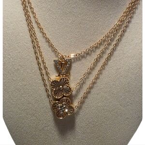 Elegant Gold Layered Necklace with Clover Charms